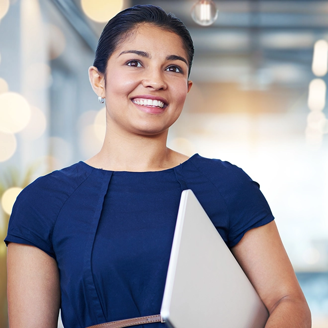 A career woman standing with a notes in her arms