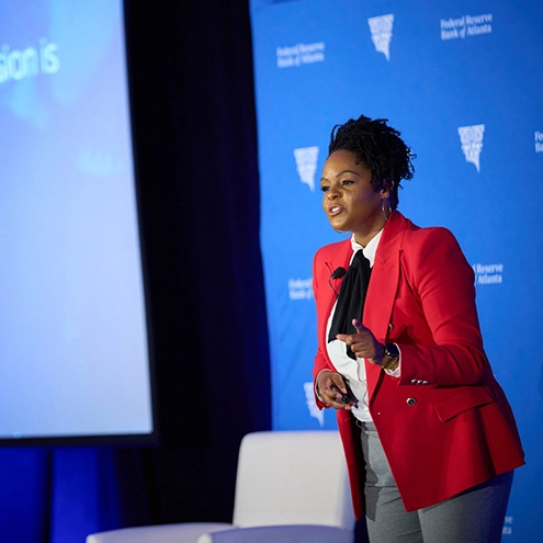 woman speaking at the podium