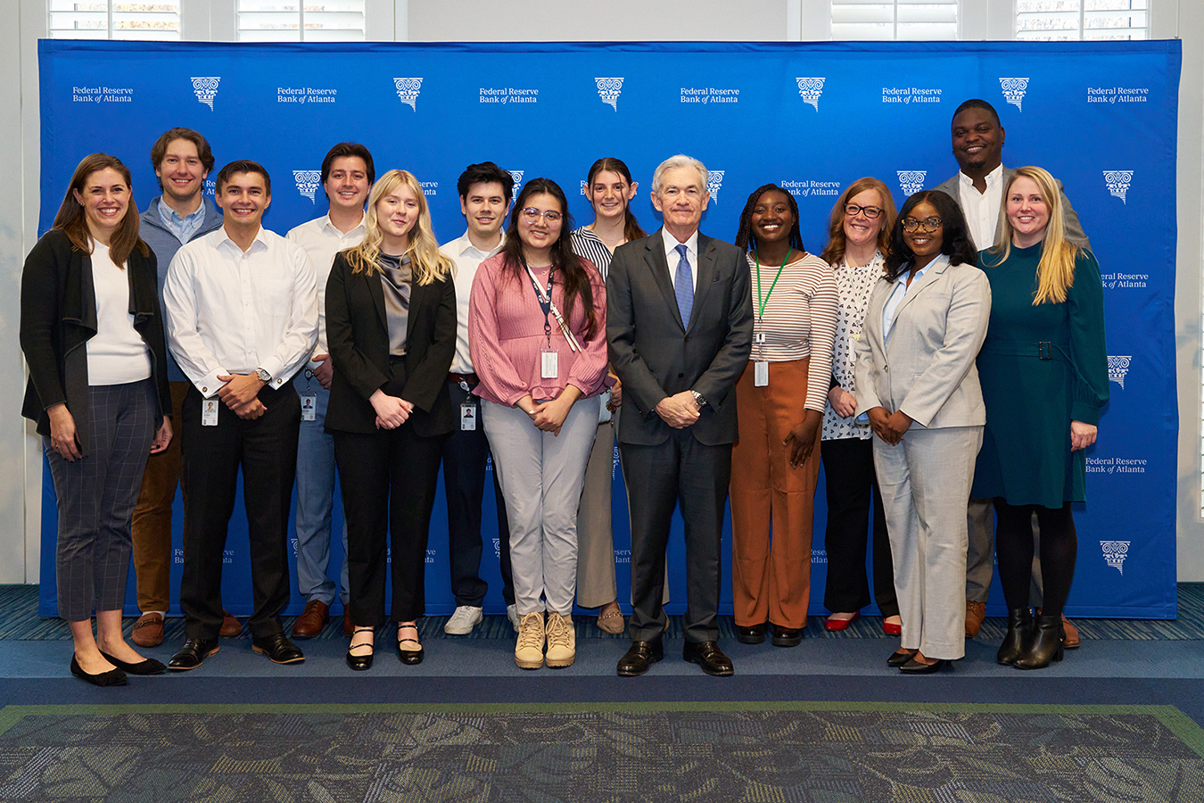 Atlanta Fed research analysts with Federal Reserve Board Chair Jerome Powell (center)