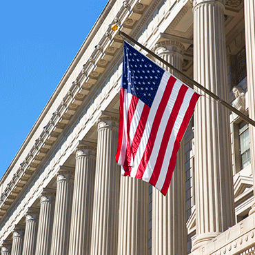 federal reserve board building facade with flag